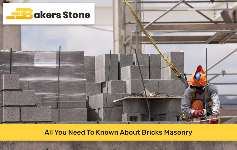 Brick masonry construction work in progress with masonry tools and materials