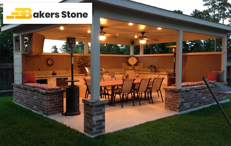 Concrete patio with brick wall featuring precise paver spacing