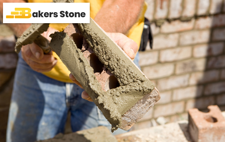 Worker laying bricks in a construction project